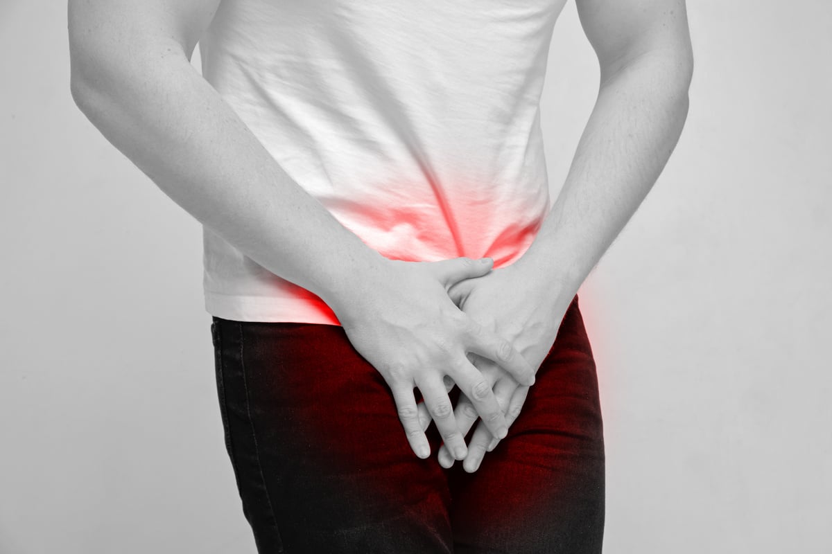 Person experiencing pain from prostate gland and urination